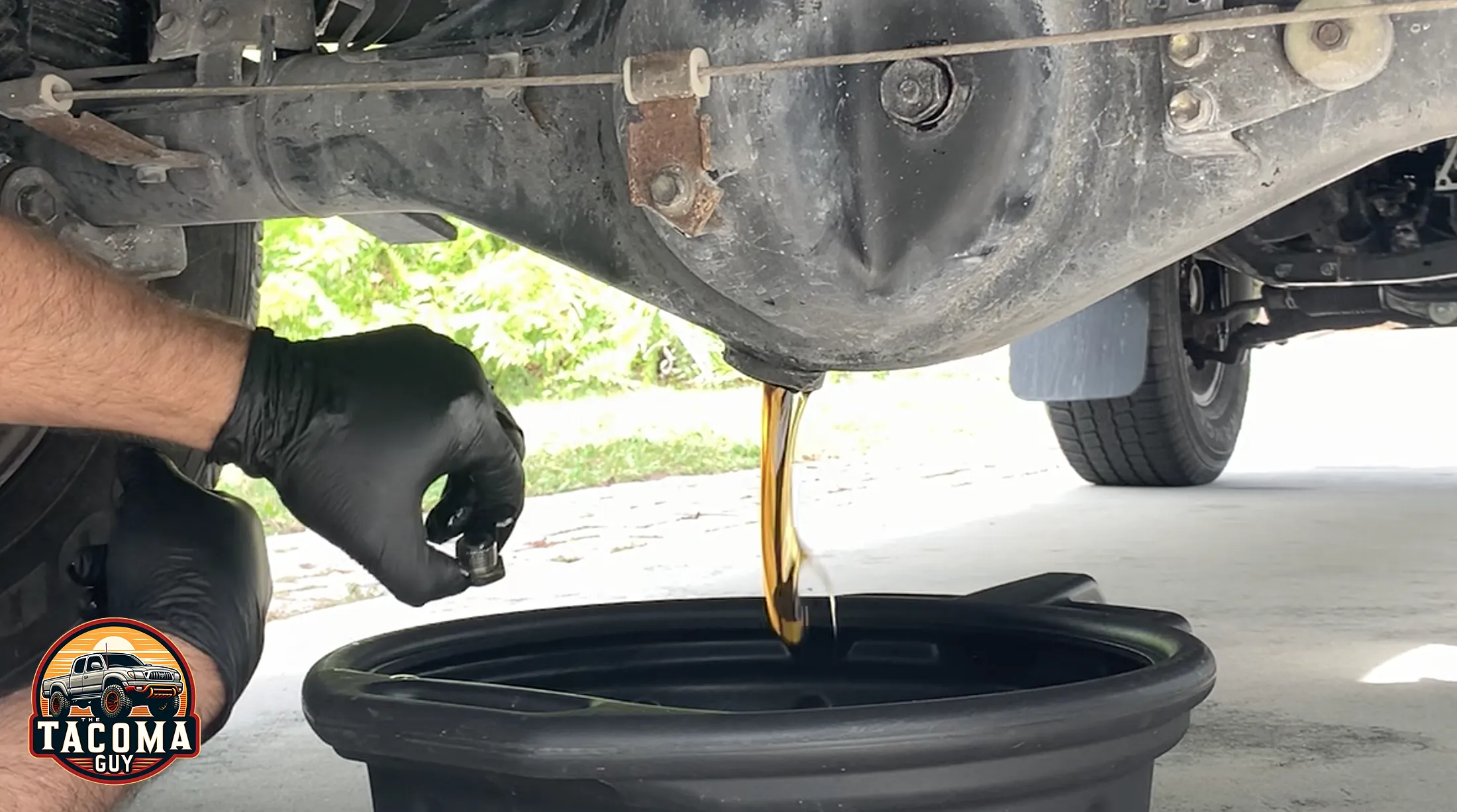 Gear oil pouring out of the drain plug of a rear differential on a 2003 gen 1 toyota tacoma