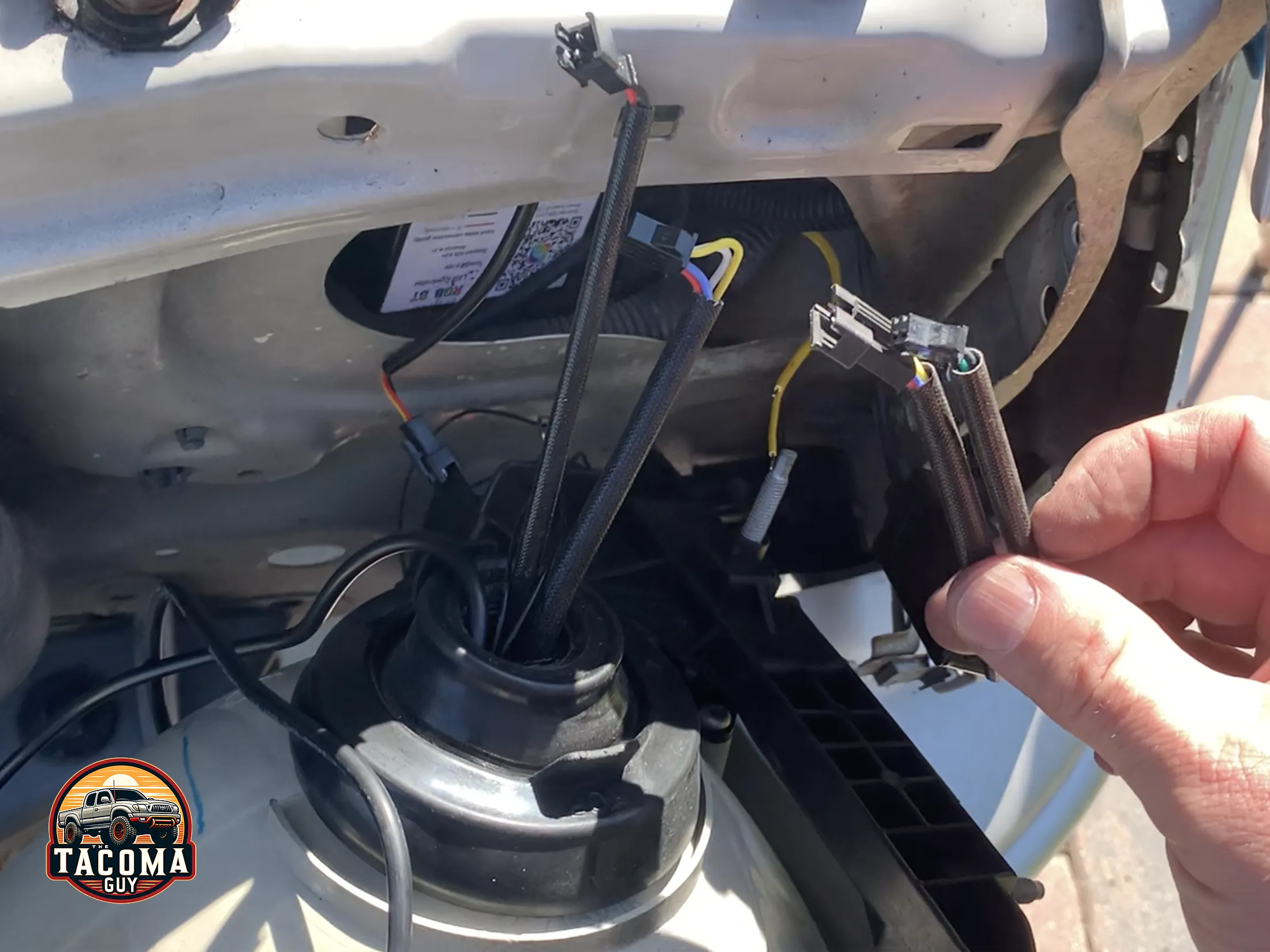 The back cabling on the TEQ Customs Retrofit headlights on a gen 1 toyota tacoma