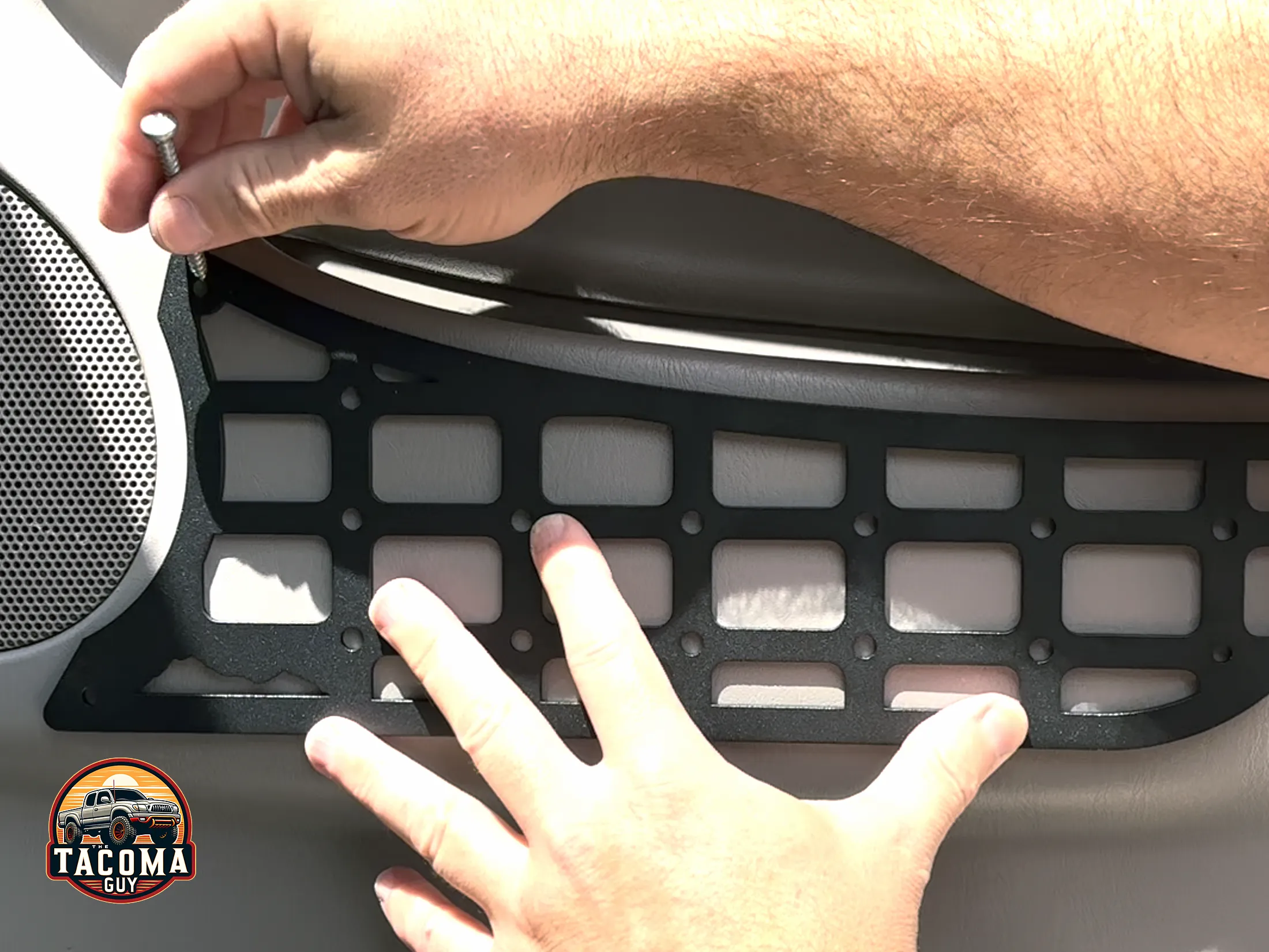 Holding up the TEQ MOLLE panel up against the gen 1 tacoma door card before installation to mark drill holes