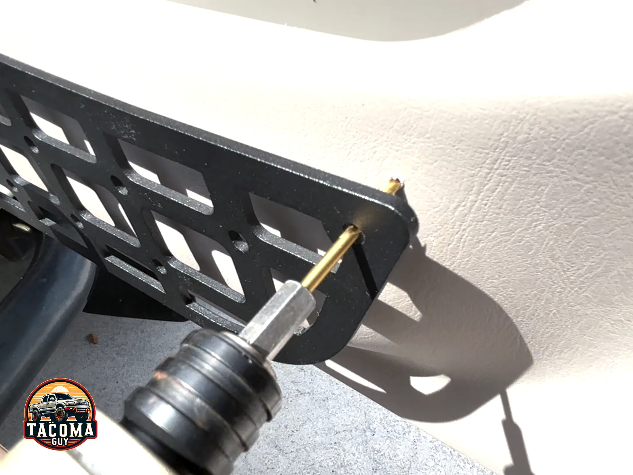 Drilling out the bolt holes next to the door pocket for the TEQ MOLLE panel