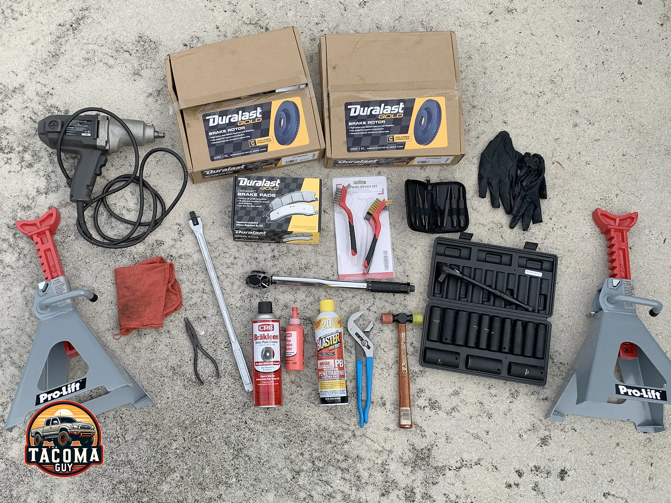 A pile of the items needed to replace the front brakes and rotors on a Gen 1 Toyota Tacoma like: PB Blaster, Brakleen, Breaker Bar, Channel Locks, Torque Wrench, Jack Stands