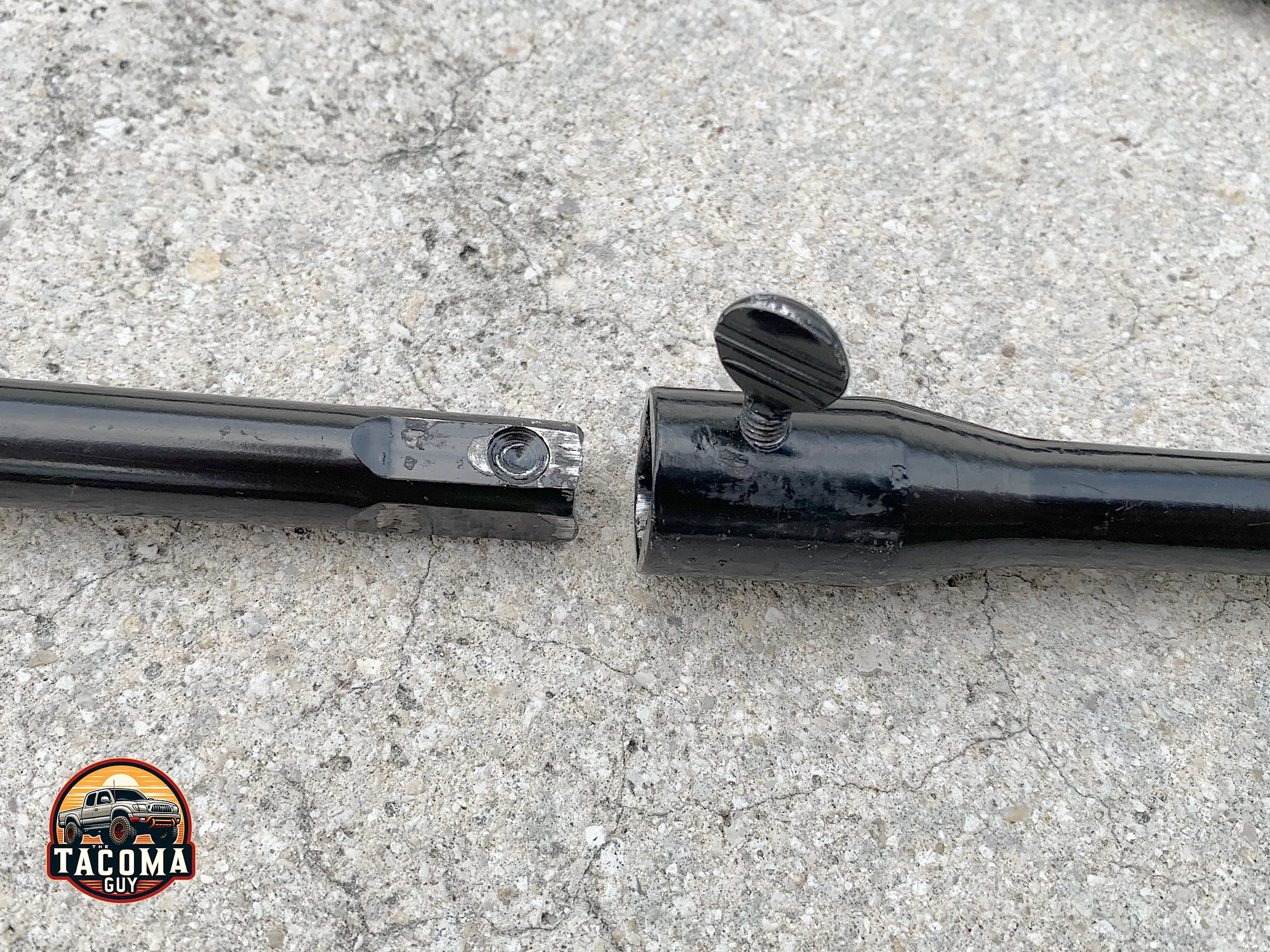 Close-up of the OEM Toyota Tacoma Spare Tire Jack Handle and Lug Wrench Kit connections